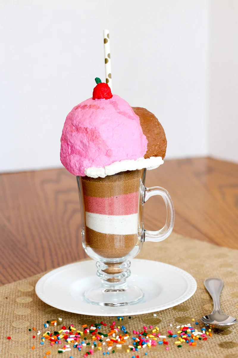 This is such a cute art project! Create ice cream sundae sculptures with Scenic Sand colored sand and CelluClay instant paper mache. Get all of the instructions in this post! #celluclay #coloredsand #sculptureproject